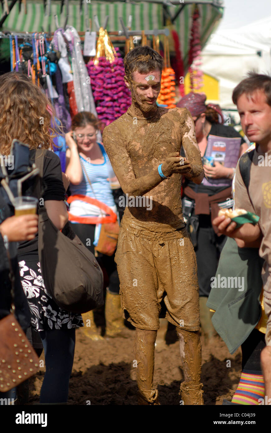 Mud covered festival dancer